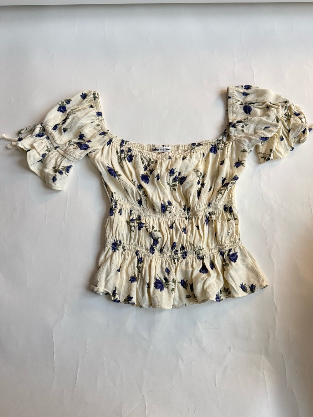 Reformation Cream Off-Shoulder Smocked Peplum Solis Top with Blue Floral